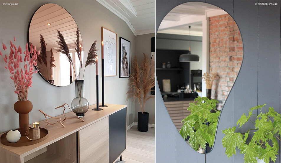 Rund spegel i roséguld mot grå vägg - droppformad spegel mot grå vägg